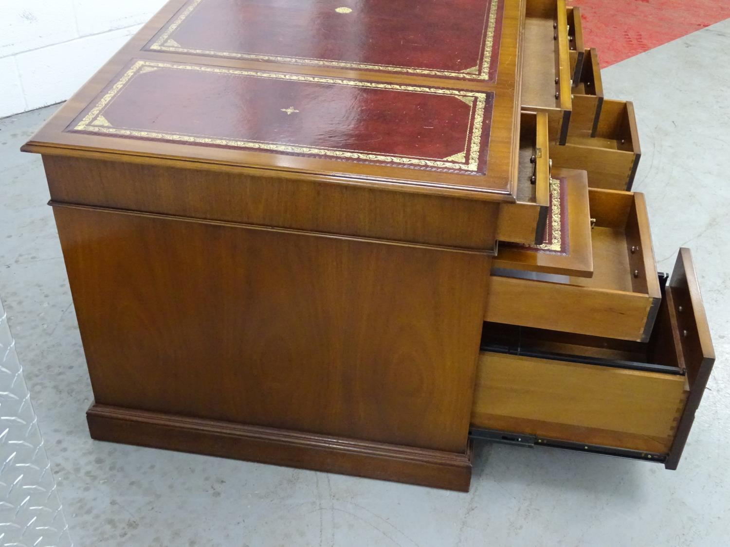 Partners Desk - a 20th C mahogany pedestal desk with gold tooled red leather inserts to top, with - Image 5 of 8