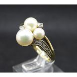 Designer ring : a 9 ct gold imported pearls , diamonds and gold ring, weighing 48 gms , 1993 ,