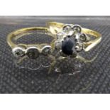Two 9 ct gold rings, one a sapphire solitare with diamond oval surround together with a 3 stone