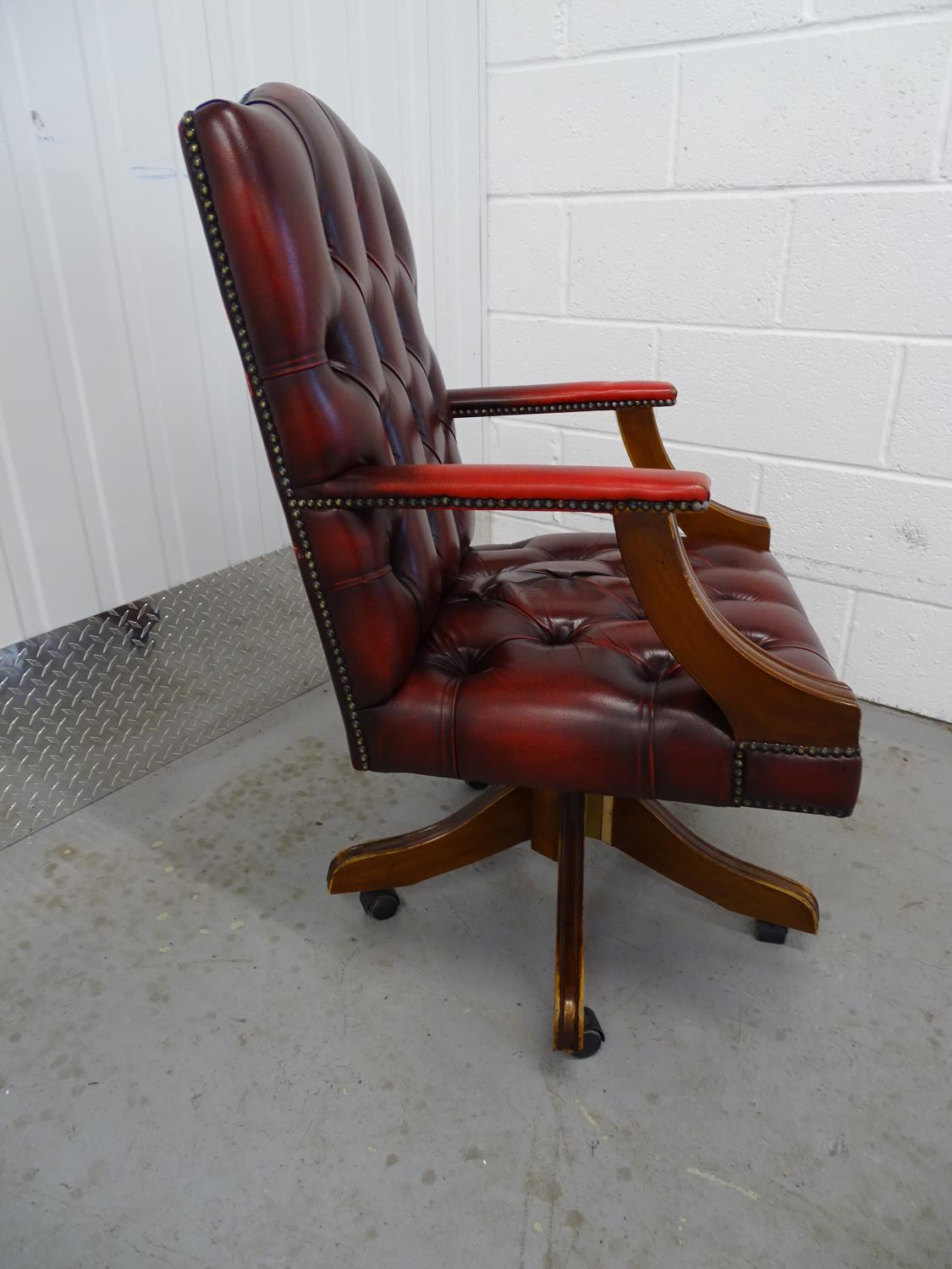 Leather Chair - a Sang de Beouf Leather button back , open arm, swivel office chair with 5 spoke