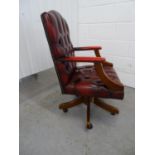 Leather Chair - a Sang de Beouf Leather button back , open arm, swivel office chair with 5 spoke