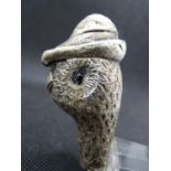 A Hallmarked Silver walking Stick / Cane handle formed as the head of a grouse wearing a hat with