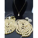 Christian Dior - a faux Baroque drop pearl on a gold plated adjustable length chain ( signed) 18/