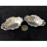 Pair embossed H M Silver Dishes - a pair of oval dishes with fish scale and harebell etc.London