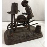 19 thC Bar Top Cigar/ Match - a cast iron sculpture of a Tinker / Knife Grinder wearing a Bicorne