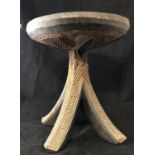 Ethnographic Native Tribal - An African carved wooden four legged stool with concave circular carved