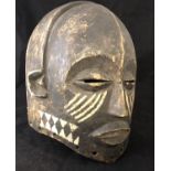 Ethnographic Native Tribal - a full head mask of carved wood with hand painted white on black
