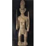 Ethnographic Native Tribal - a Pacific / Oceanic Borneo carved wooden figure of a soldier carrying a