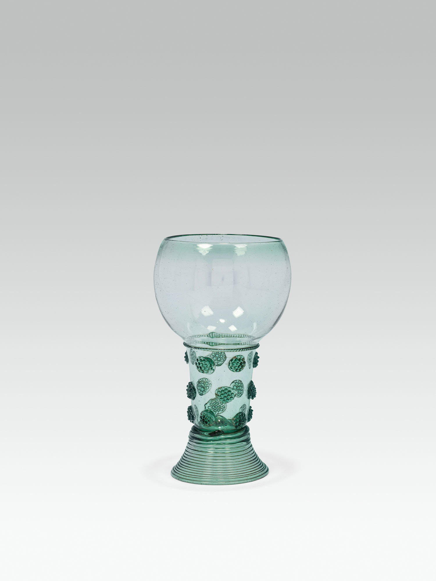 Large Römergreen glass; rased base with pontil mark; spun, conical foot; cylindrical, hollow shaft