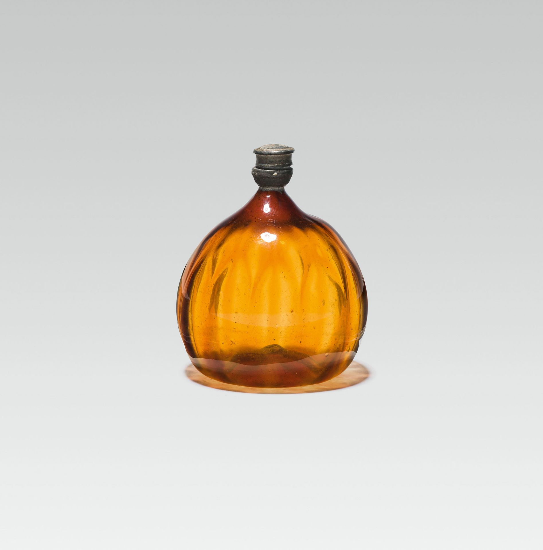 Amber bottleamber glass; pontil mark at the base; round, globular body, walling structured in the