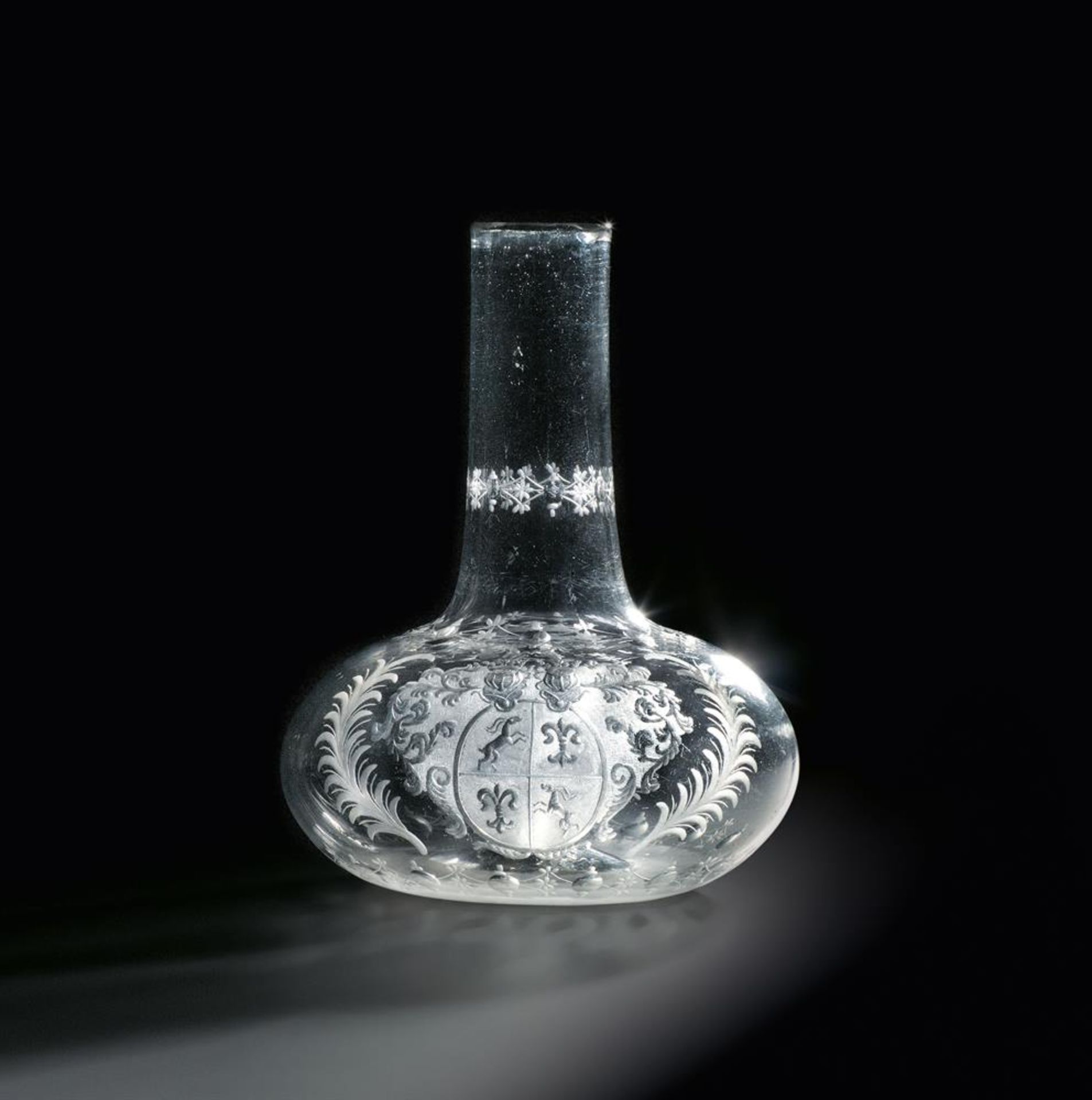 Bottle with emblem "von Puck"colourless glass; pointil mark at the base; monogrammed on the reverse: