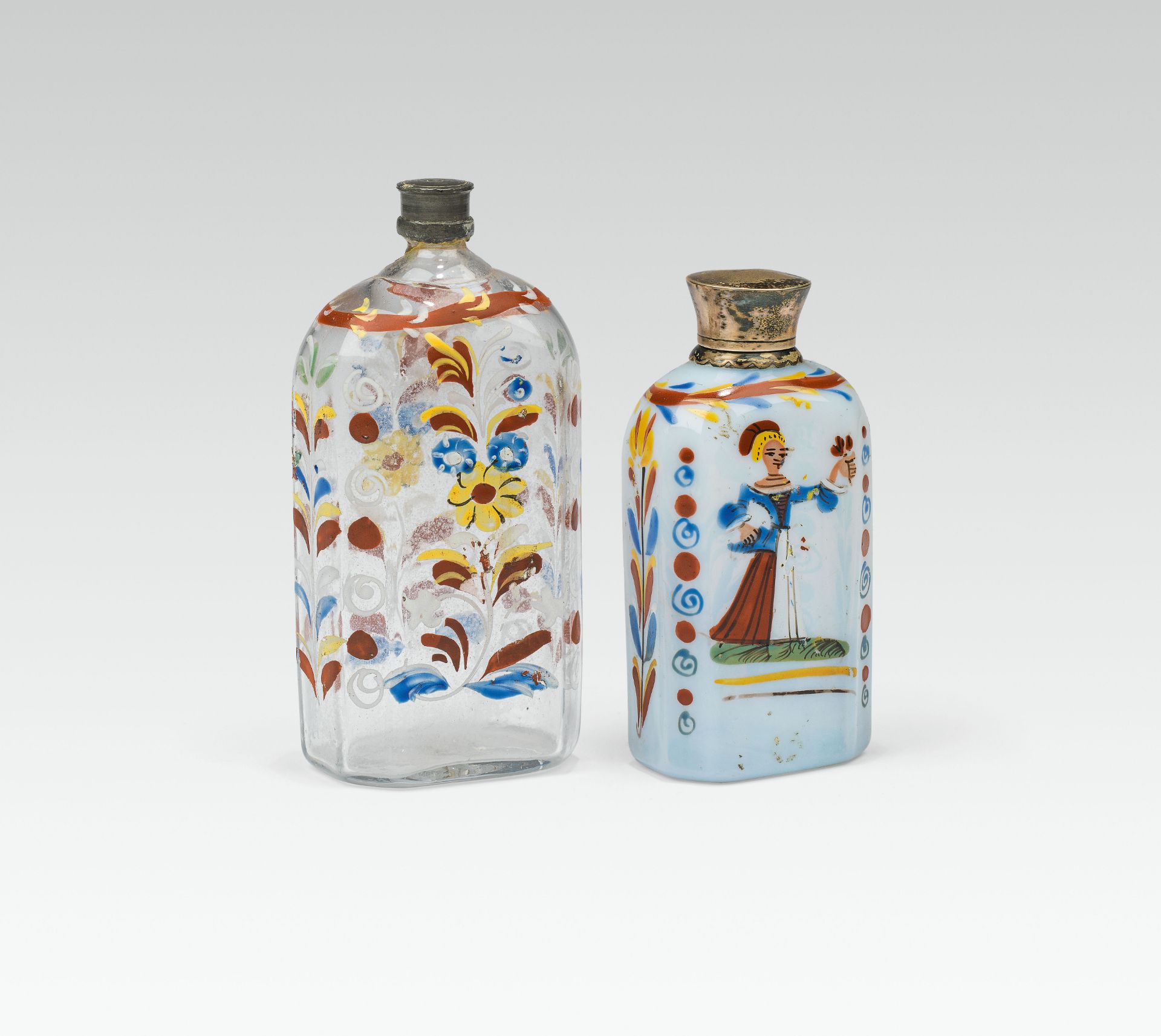 2 Bottlescolourless glass and frosted glass; pontil mark at the base, polychrome enamel colourh.