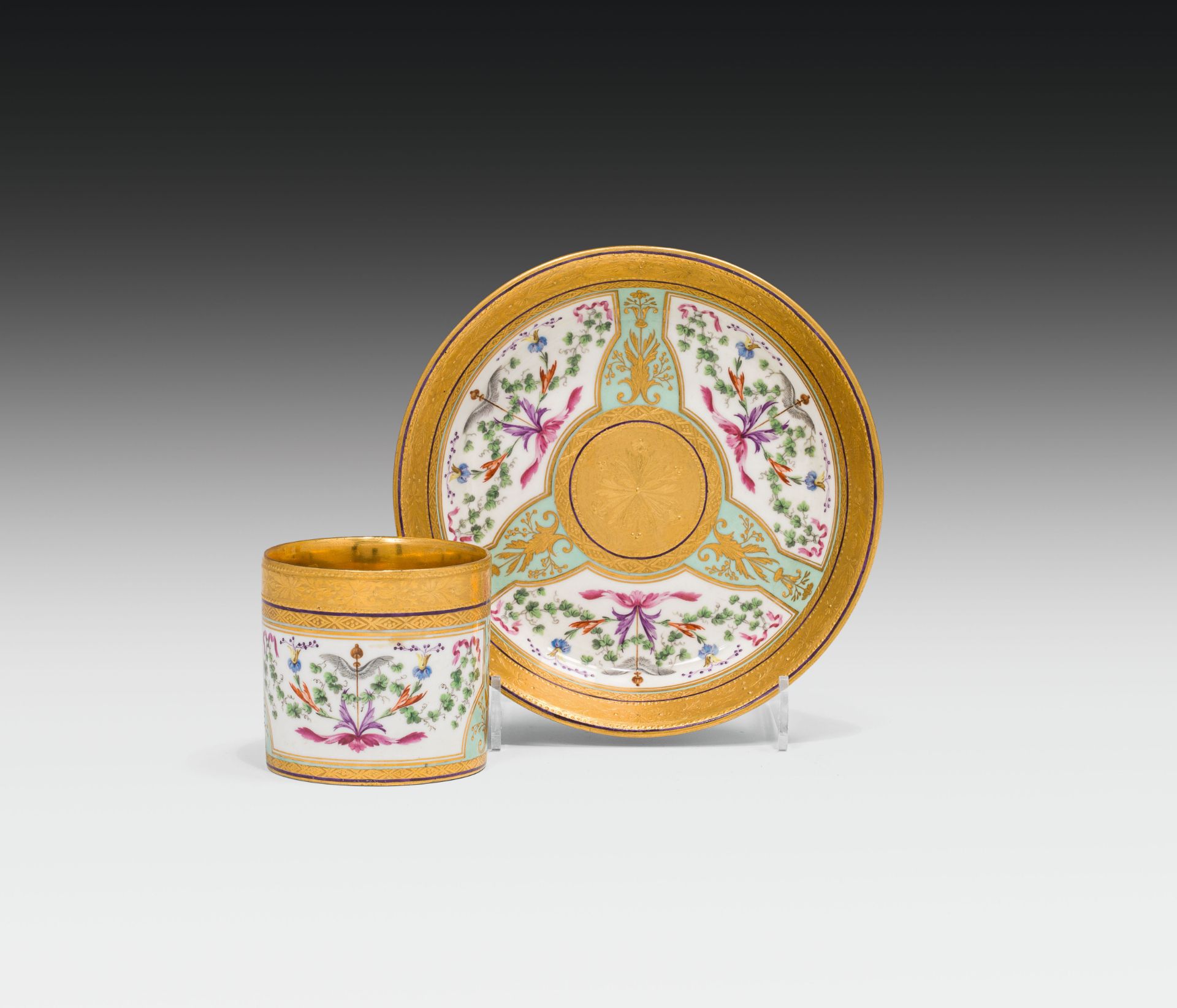 Cup and saucerporcelain, colourfully painted and glazed; partly gilded; marked: blue shield,