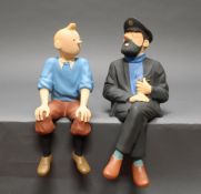 2 Comicfiguren, "Tintin sitzend", "Capitaine Haddock sitzend", Frankreich, 20. Jh., Kunstharz, poly