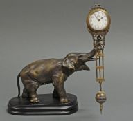 Tischuhr, Myterieuse, neuzeitlich, Bronzeelefant, auf Rüssel Uhr tragend, Holzsockel, Werk
