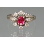 Ring, WG 750, 1 oval facettierter Rubin, 6 Brillanten zus. ca. 0.18 ct., 6 Besatzdiamanten, 5 g, RM