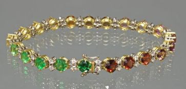 Armband, GG 750, 42 Brillanten zus. ca. 2.10 ct., 21 verschiedenfarbene Edelsteine u.a. Citrin, ver