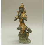 Figur, "Flötenspielerin", Thailand, neuzeitlich, Bronze, grünlich und golden patiniert, 36 cm hoch