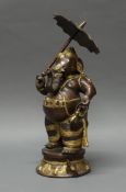 Figur, "Ganesha mit Schirm und Kanne", Indien, 20. Jh., Metall, patiniert, 38 cm hoch