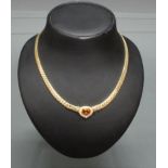 Collier, GG 585, oval facettierter Citrin, 18 Brillanten zus. ca. 0.18 ct., 41 cm lang, 18 g