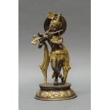 Figur, "Krishna mit Instrument", Indien, 20. Jh., Metall, patiniert, 29 cm hoch