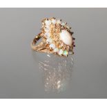 Ring, GG 585, 1 ovaler Opal-Cabochon, 16 runde Opal-Cabochons, 16 Besatz-Diamanten, 9 g, RM 17