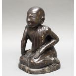 Figur, "Kniender Mönch", Burma, 19./20. Jh., Holz, schwarz lackiert, 35 cm hoch