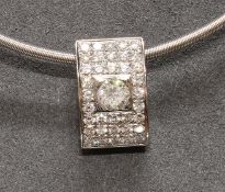 Collieranhänger, WG 750, 1 Diamant, ca. 1,00 - 1,05 ct, tcr/si, Altschliff, 36 Brillanten, zus. ca.
