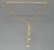 Y-Collier/Königskette, mit Verstellclip, WG/GG 585, 27 Diamanten zus. ca. 0.25 ct., alle etwa fw/si