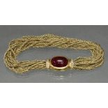 Armband, GG 750, 10 Goldstränge, Schließe ovaler Rubin-Cabochon 14.5 x 10 mm, 10 kleine Besatzdiama