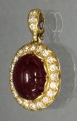 Anhänger, GG 750, 1 ovaler Rubin-Cabochon 14.5 x 12 mm, 23 Brillanten zus. ca. 0.46 ct., 7 g