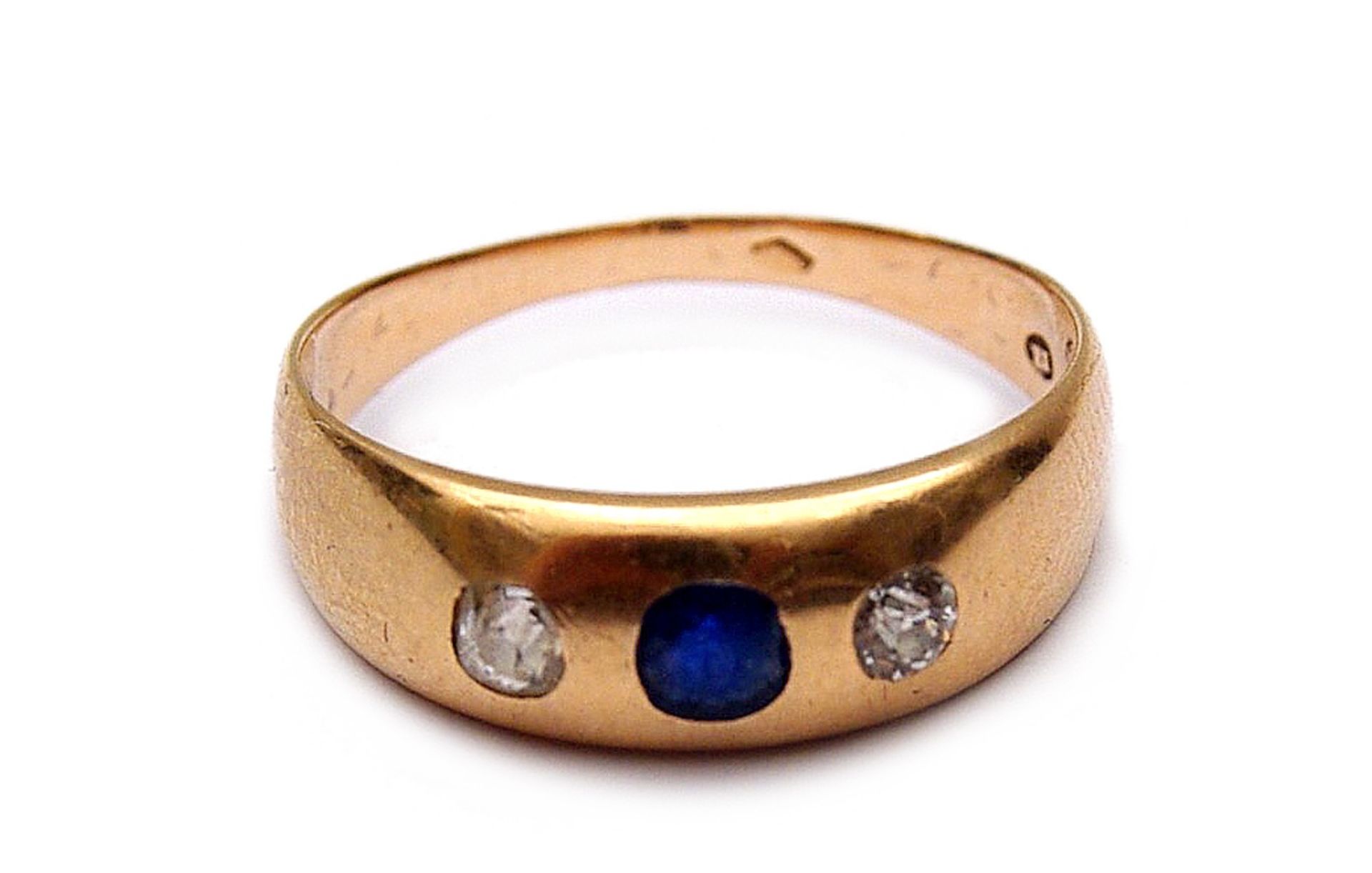 A blue sapphire and diamond ring
