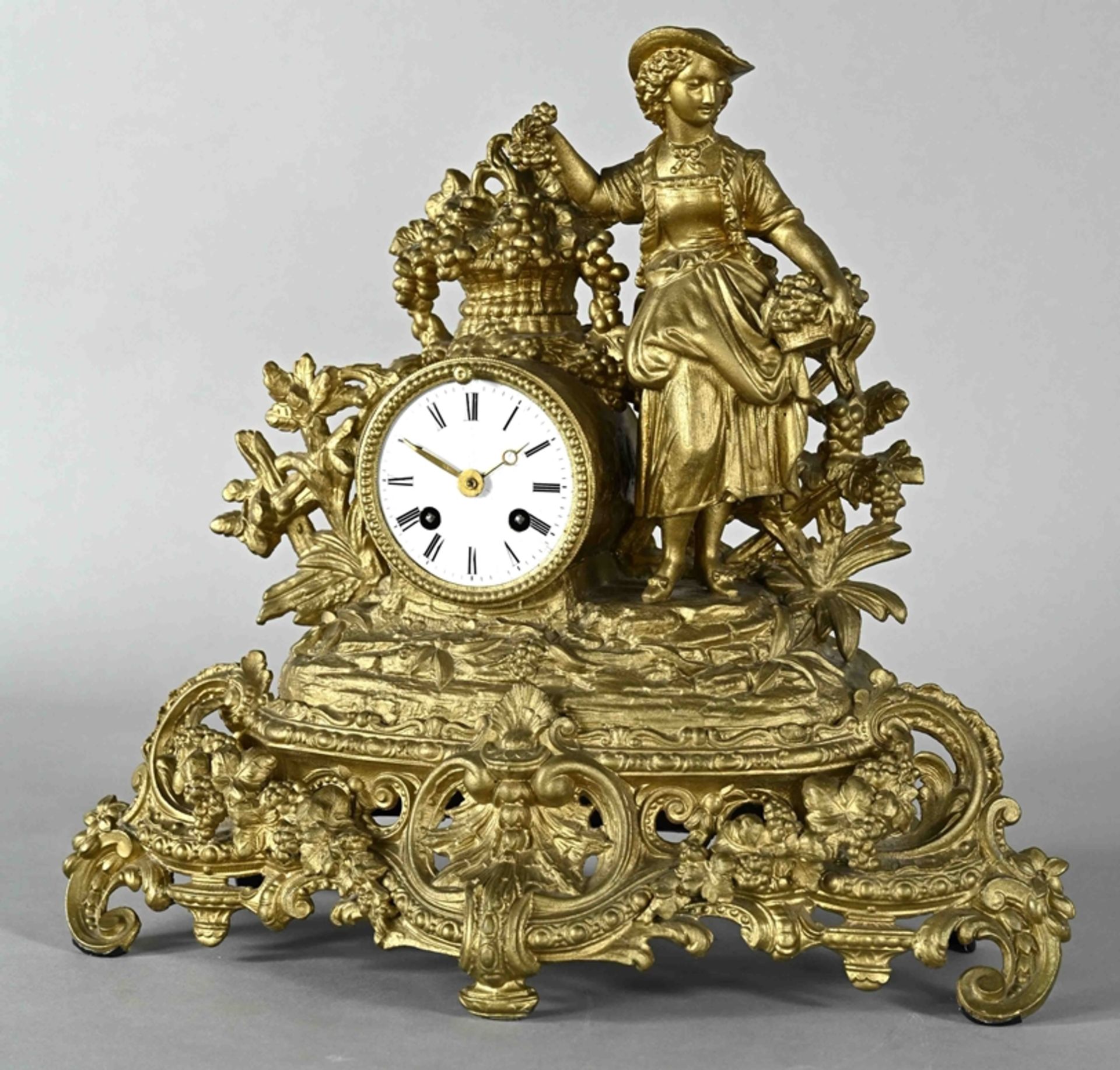 Figural table clock, German circa 1880, representation of the wine queen, bronzed pewter casting, h