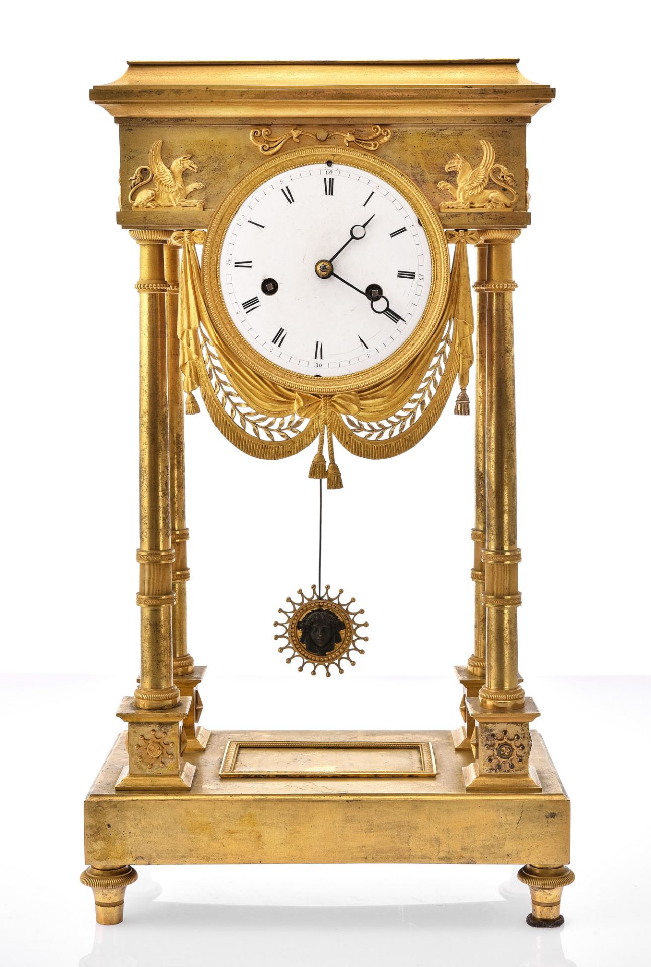 Portal clock, France circa 1820, bronze, fire gilded, decorated with griffin figures in front and o