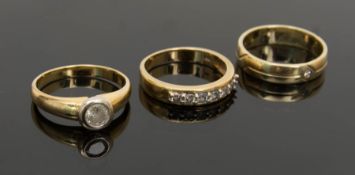 Drei Gelbgoldringe mit Brillanten, 750er und 585er.Ring mit mittigem Stein und Ring mi