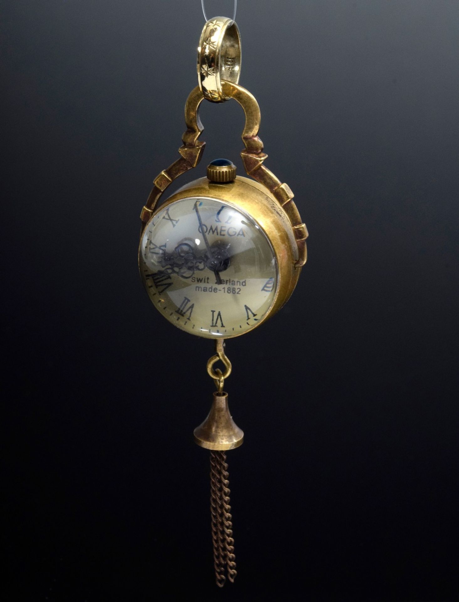Kleine Omega Kugeluhr in beidseitig verglastem M | Small Omega ball clock in brass case glazed on b