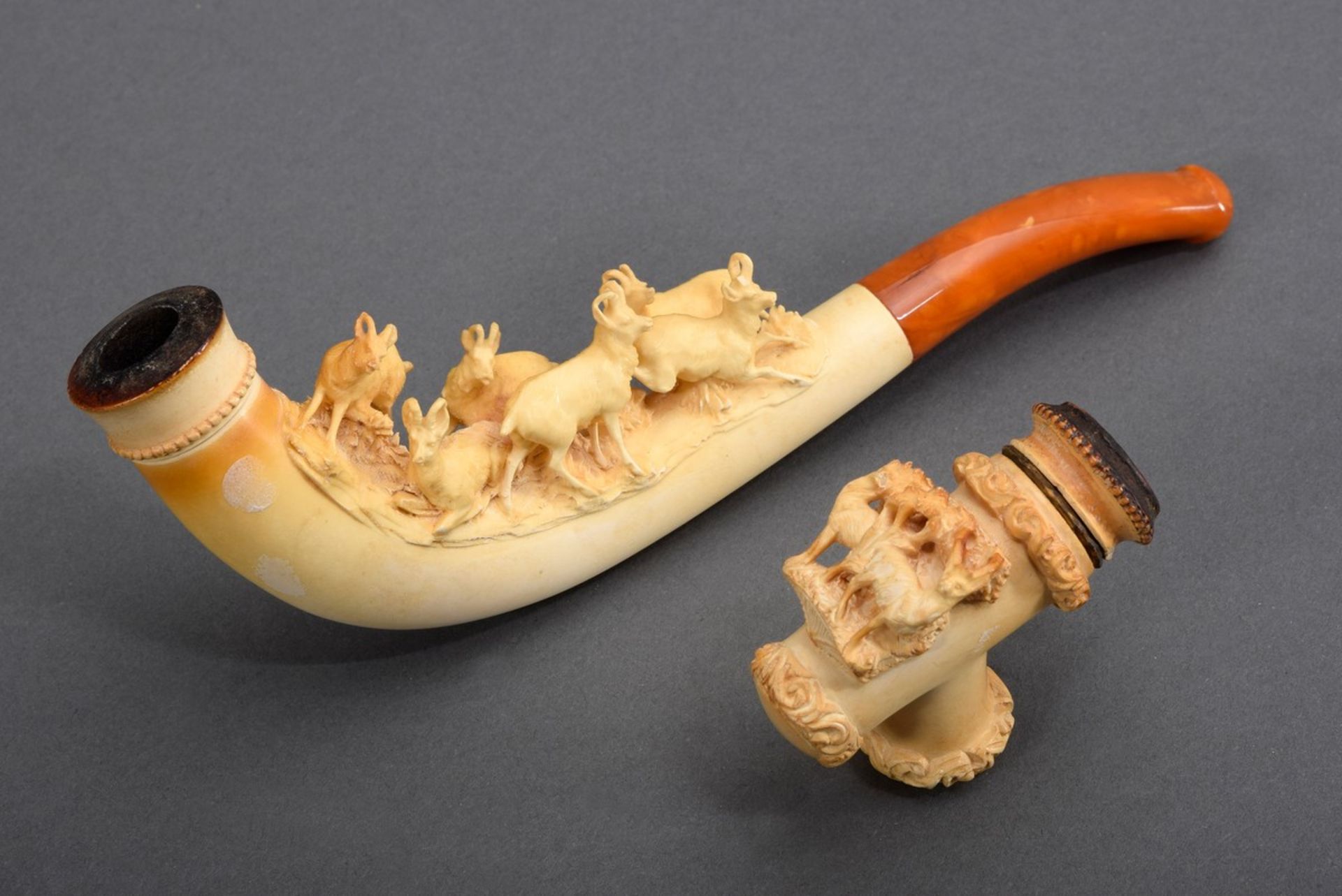 2 Various meerschaum cigar holders with sculptural figures "chamois"/"stags", 1x with amber mouthpi