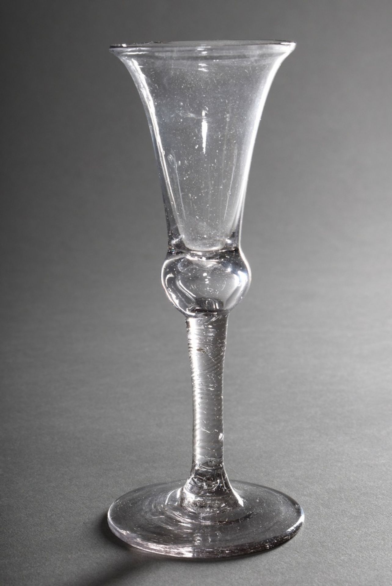 Tall goblet-shaped schnapps glass with twisted shaft, colourless glass, probably England c. 1800, h