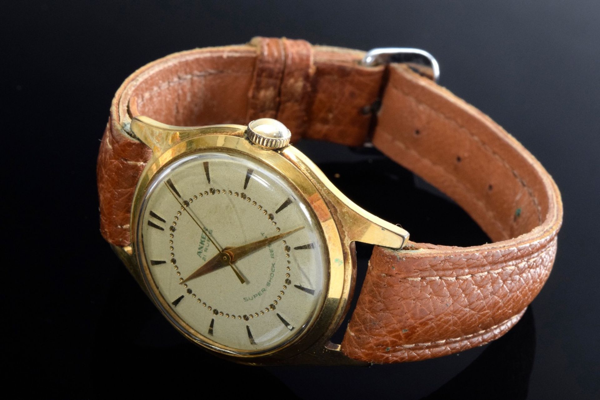 Steel-gilt "anchor" wristwatch, manual winding, large second, line and dot indices, brown leather s