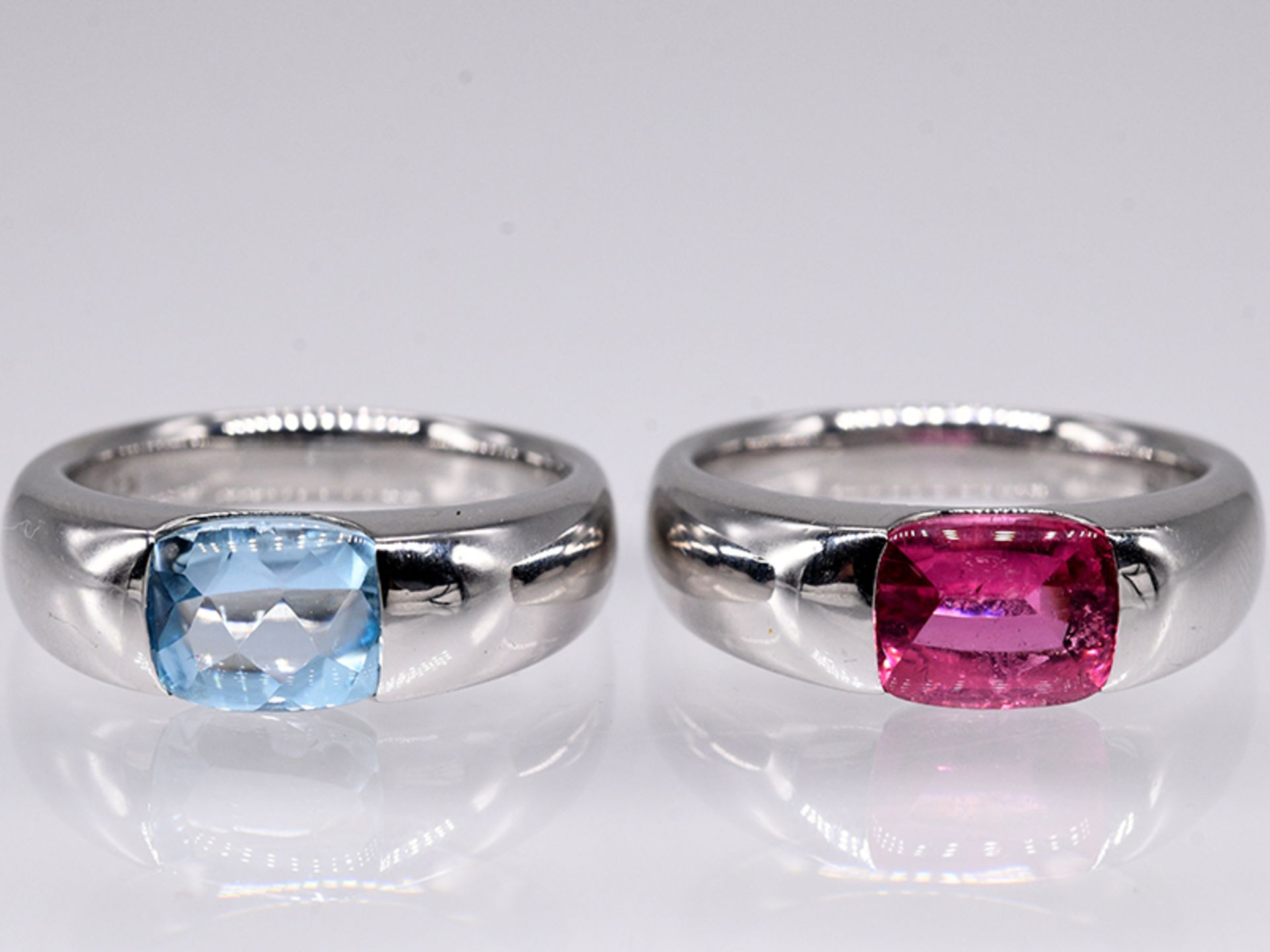 2 Bandringe mit jeweils einem Blautopas 2;50 ct und einem pinkfarbenem Turmalin 1;81 ct; Juwelier