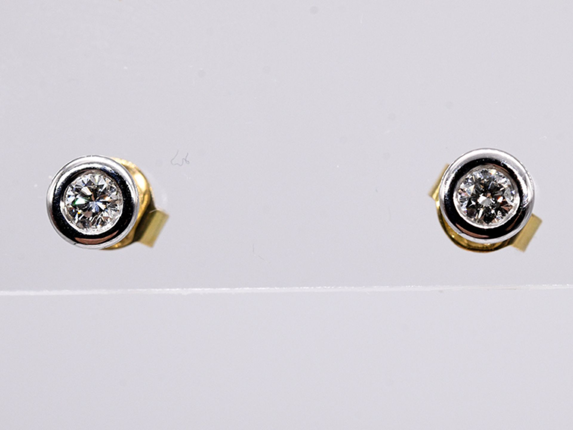 Paar Ohrstecker mit Brillanten, zus. ca. 0,2 ct, Juwelier von Haeffen, Hamburg, 21. Jh. br750/-