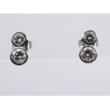 Paar Brillant-Ohrstecker, zus. ca. 1,1 ct, 21. Jh. br585/- WeiÃŸgold. Gesamtgewicht ca. 2,5 g. Je