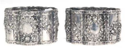 Paar Serviettenringe, 800er Silber, punziert, ca. 65 g, runde, geschweifte Form mitRosenrelie