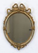 Spiegel, um 1800, Holz, Stuck, vergoldet, ovale Form mit Schleifenbekrönung, 47x33 cm