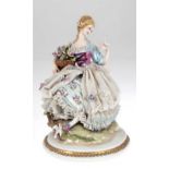 Porzellanfigur "Dame im Spitzenkleid mit Blumenkorb und Vogel", Capodimonte, Guiseppe Cappé, sign.,