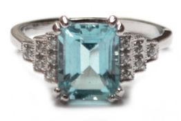 Ring, 925er Silber, rhodiniert, Blautopas ca. 1,0 x 0,8 cm, dreigetreppte Ringschultern besetzt  mi