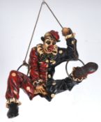 Raumdeko "Clown mit zerrissener Hose", um 1980, am Seil mit Eisenringen hängend, Gußmasse, farbig b