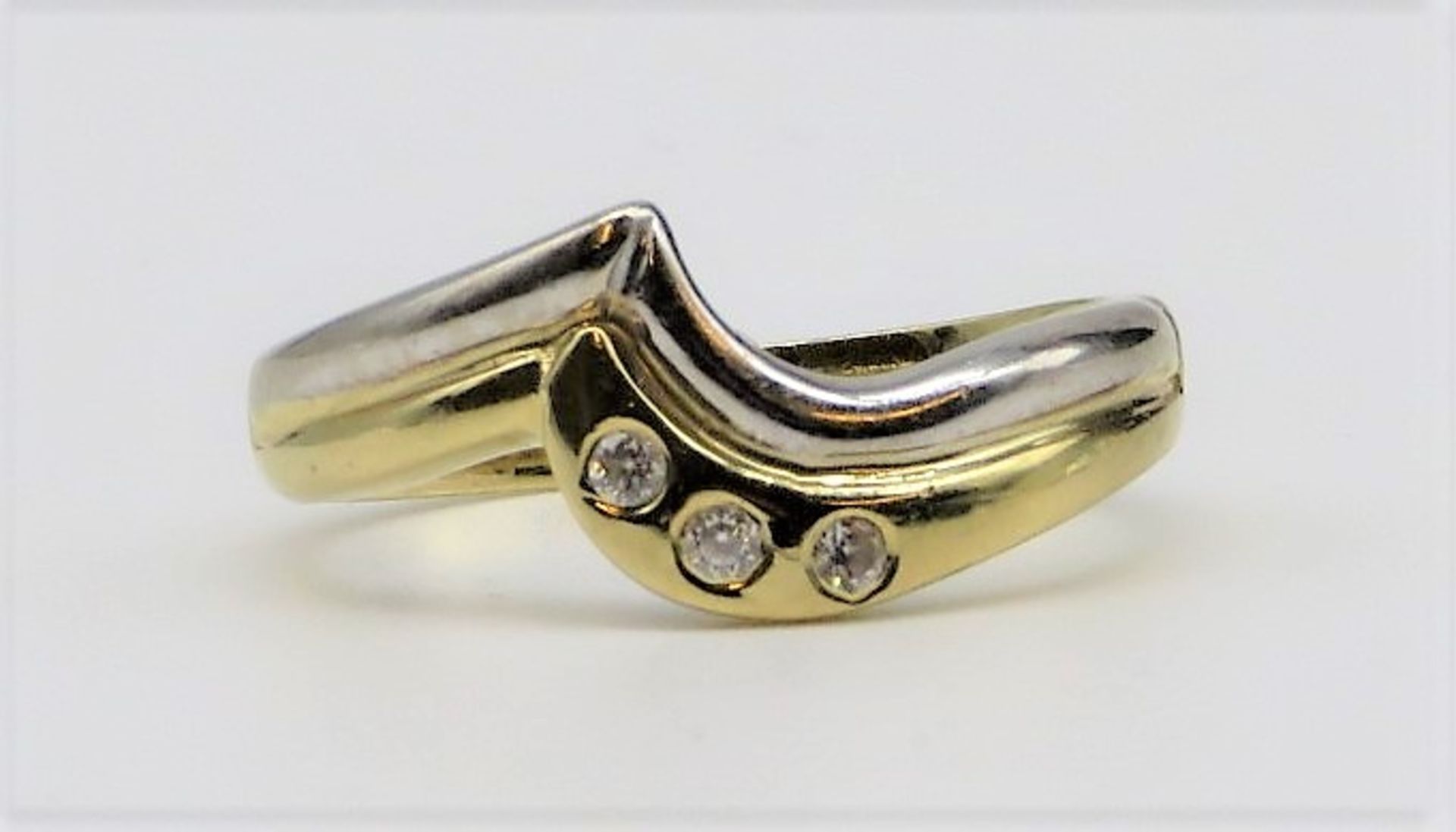 Damenring mit 3 Brillanten, zus.ca. 0,06 ct, Juweliersigné "CAN", 585er Weiß- und Gelbgold, 3,85 g,