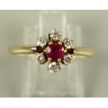 Ring mit 6 Brillanten, total ca.0,24ct und zentralem Rubin, 585er Gold, Gew.3,8