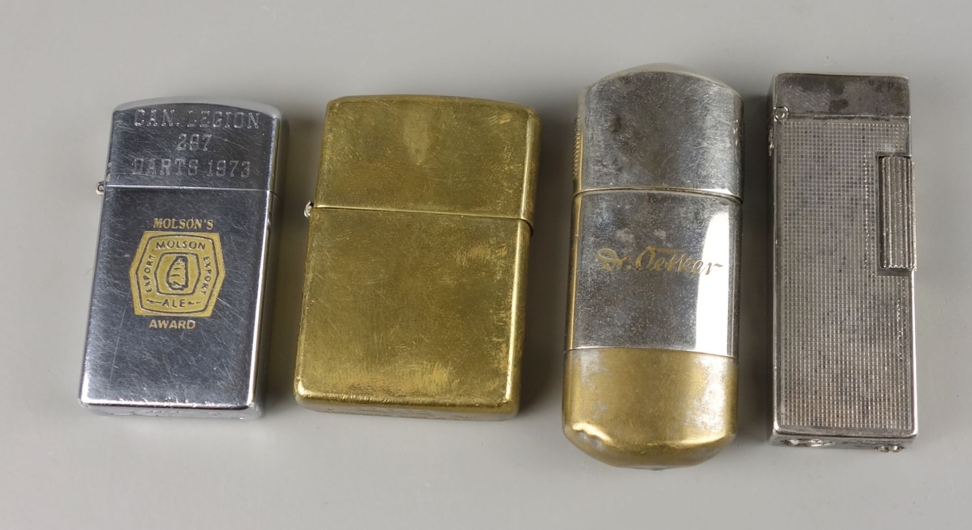 4 Feuerzeuge, u.a. Zippo, Mitte 20.Jh.